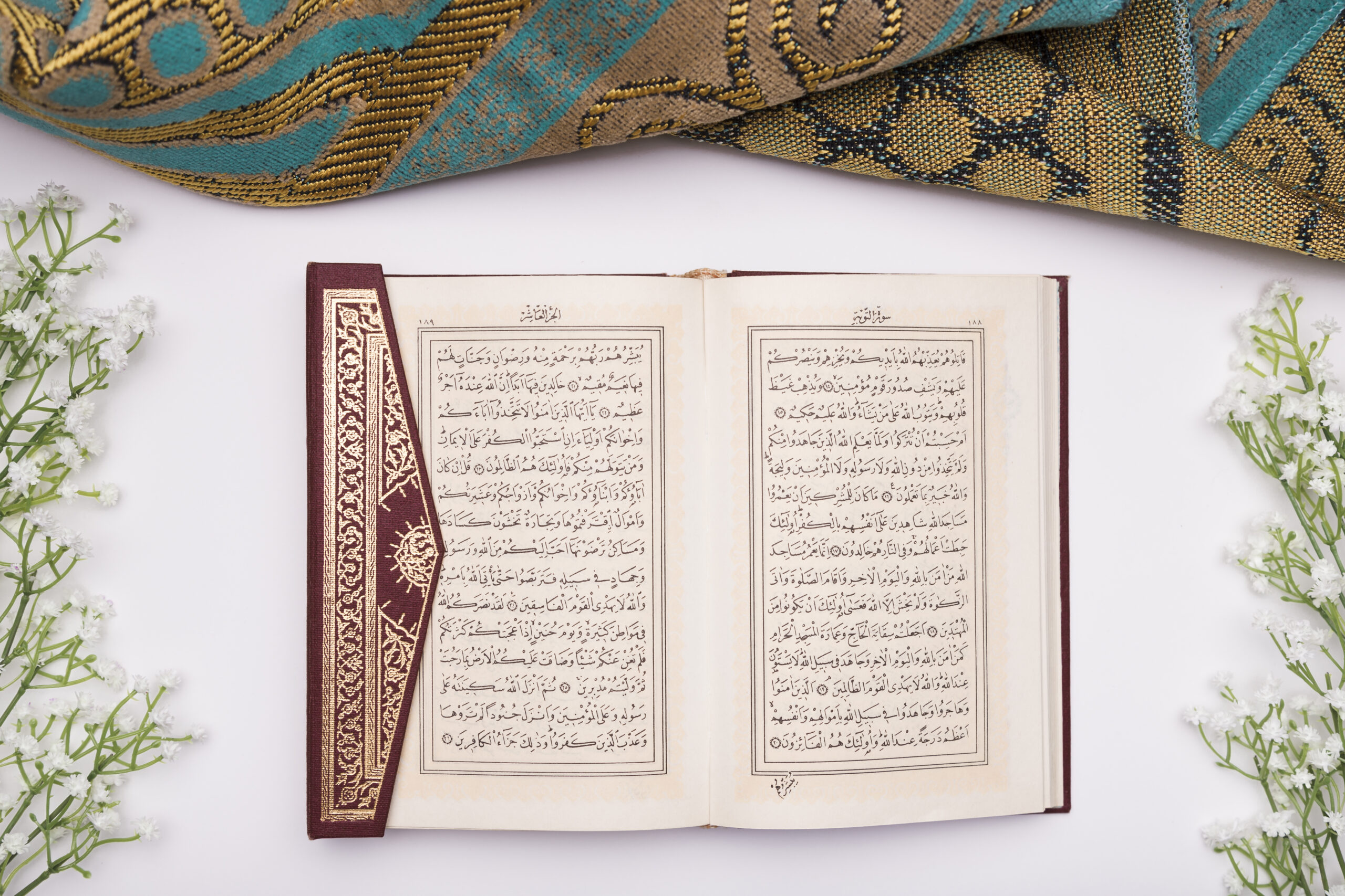 Quran opened on a table, symbolizing Quranic Learning, online Quran learning, classes, and tutoring services for kids and adults,Online Quran learning Quran classes online Learn Quran online Quran tutoring services Online Quran teaching Best online Quran courses